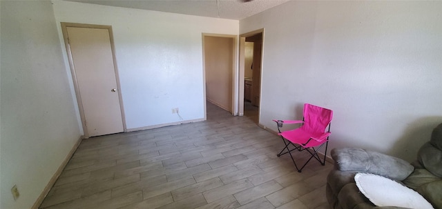 605 N Davis Dr, Arlington, TX 76012 - sitting room featuring baseboards
