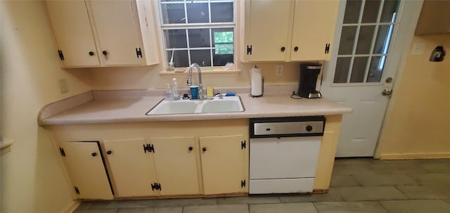 605 N Davis Dr, Arlington, TX 76012 - kitchen featuring light countertops, dishwasher, and light tile patterned floors