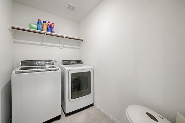 1773 Courage Crk, Crandall, TX 75114 - washroom featuring washer and dryer and light tile patterned floors