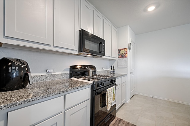 1773 Courage Crk, Crandall, TX 75114 - kitchen featuring black appliances, dark stone countertops, and white cabinets