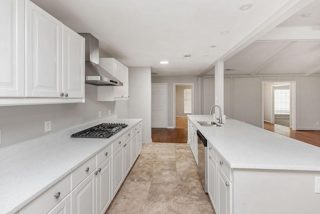 3101 Bonniebrook Dr, Plano, TX 75075 - kitchen featuring wall chimney exhaust hood, stainless steel gas cooktop, white cabinetry, and light countertops