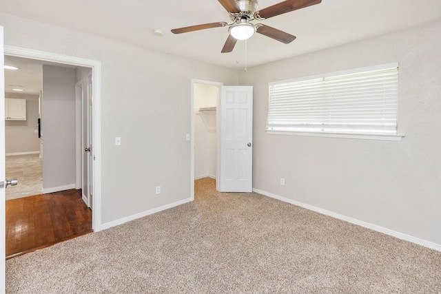 3101 Bonniebrook Dr, Plano, TX 75075 - unfurnished bedroom featuring carpet floors, a walk in closet, a closet, and a ceiling fan