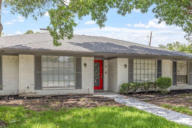 3101 Bonniebrook Dr, Plano, TX 75075 - view of front of house featuring brick siding and roof with shingles