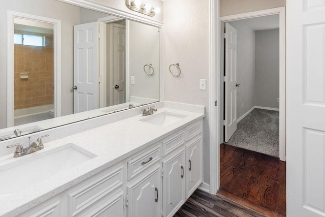 3101 Bonniebrook Dr, Plano, TX 75075 - full bathroom featuring wood finished floors and double vanity
