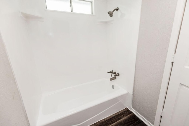 3101 Bonniebrook Dr, Plano, TX 75075 - bathroom featuring shower / tub combination and wood finished floors