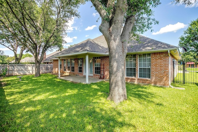 133 Sunny Meadows Dr, Burleson, TX 76028 - rear view of property with brick siding, a patio area, and roof with shingles