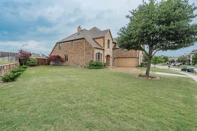 637 Grisham, Fate, TX 75087 - view of side of property with driveway, a chimney, brick siding, and an attached garage
