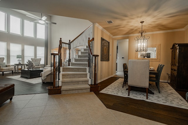 637 Grisham, Fate, TX 75087 - dining space with tile patterned floors, ceiling fan, stairway, a chandelier, and ornamental molding