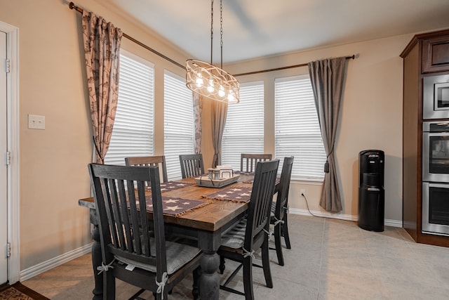637 Grisham, Fate, TX 75087 - dining space featuring light tile patterned floors and a chandelier