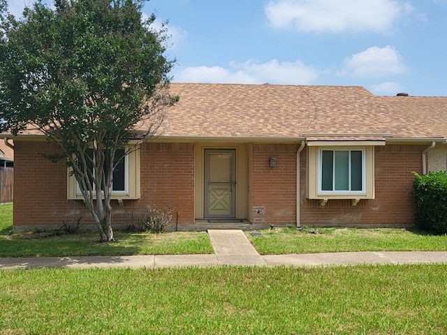 56 E Mountain Creek Dr Unit 22, Grand Prairie, TX 75052 - ranch-style home with brick siding, a front lawn, and a shingled roof
