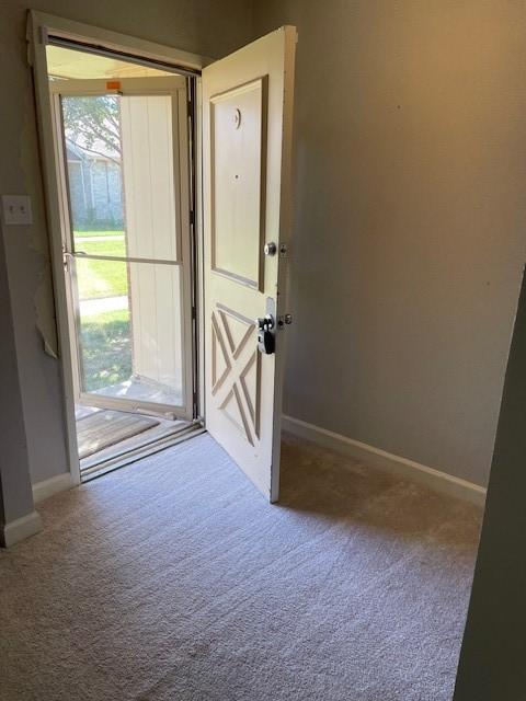 56 E Mountain Creek Dr Unit 22, Grand Prairie, TX 75052 - doorway featuring carpet flooring