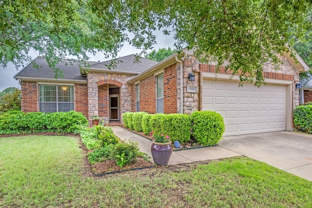 1506 Pine Hills Ln, Corinth, TX 76210 - view of front of home with a garage, brick siding, concrete driveway, a front yard, and stone siding