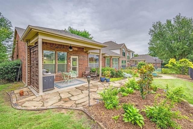 1506 Pine Hills Ln, Corinth, TX 76210 - back of property featuring a ceiling fan, a patio, and brick siding