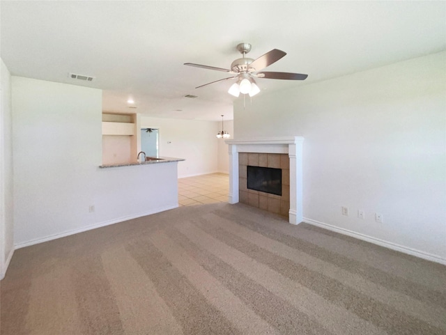 6231 Bridle Trl, Caddo Mills, TX 75135 - unfurnished living room with ceiling fan, a fireplace, and light colored carpet