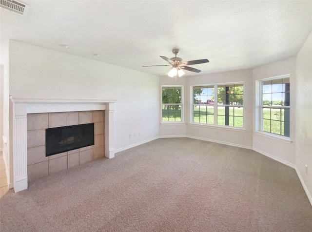 6231 Bridle Trl, Caddo Mills, TX 75135 - unfurnished living room with a tile fireplace, carpet floors, and ceiling fan