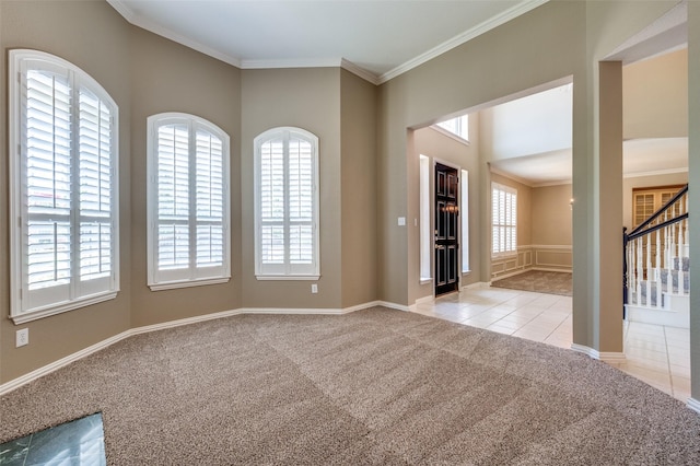 6001 Autumn Way, Mckinney, TX 75072 - spare room featuring light colored carpet, plenty of natural light, ornamental molding, and stairway