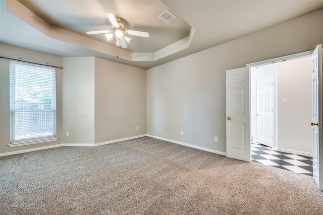 6001 Autumn Way, Mckinney, TX 75072 - carpeted spare room with ceiling fan, a raised ceiling, and tile patterned floors