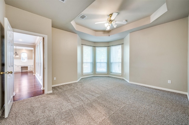 6001 Autumn Way, Mckinney, TX 75072 - spare room with carpet, ceiling fan, and a tray ceiling