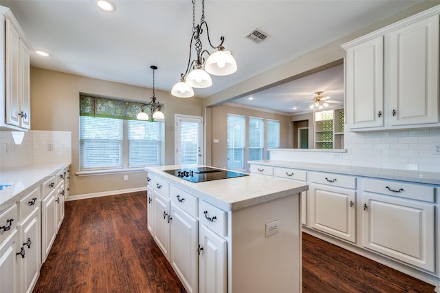 6001 Autumn Way, Mckinney, TX 75072 - kitchen featuring black electric cooktop, a center island, recessed lighting, and white cabinetry