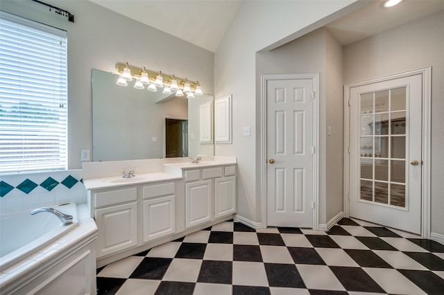 6001 Autumn Way, Mckinney, TX 75072 - bathroom featuring tile patterned floors, double vanity, a bath, and vaulted ceiling