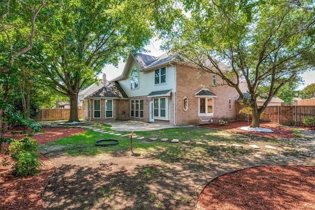 6001 Autumn Way, Mckinney, TX 75072 - back of house featuring a fenced backyard, brick siding, a patio, and a chimney