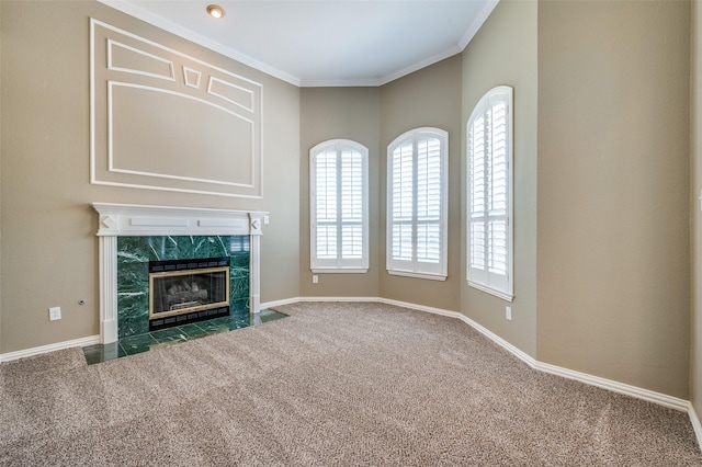 6001 Autumn Way, Mckinney, TX 75072 - unfurnished living room featuring carpet, plenty of natural light, a premium fireplace, and crown molding