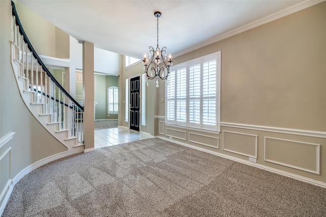 6001 Autumn Way, Mckinney, TX 75072 - unfurnished dining area featuring carpet, healthy amount of natural light, stairway, a chandelier, and wainscoting