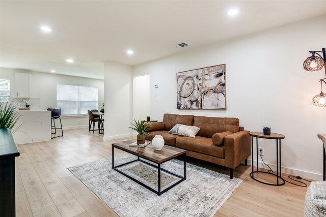 826 Nash St, Rockwall, TX 75087 - living room with light wood finished floors and recessed lighting