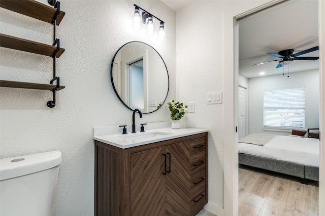 826 Nash St, Rockwall, TX 75087 - bathroom with vanity, ceiling fan, wood finished floors, and ensuite bath