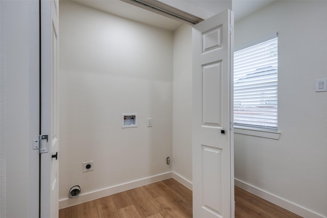 826 Nash St, Rockwall, TX 75087 - laundry area with electric dryer hookup, light wood-type flooring, and washer hookup