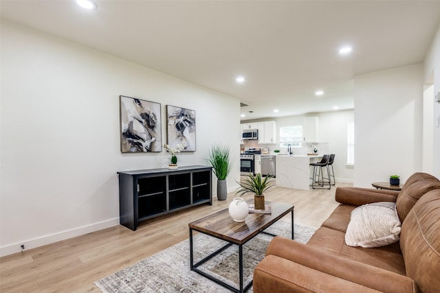 826 Nash St, Rockwall, TX 75087 - living room featuring recessed lighting and light wood-style flooring