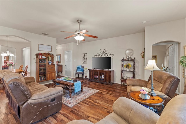 118 Independence Trl, Forney, TX 75126 - living area with arched walkways, wood finished floors, a ceiling fan, and a chandelier