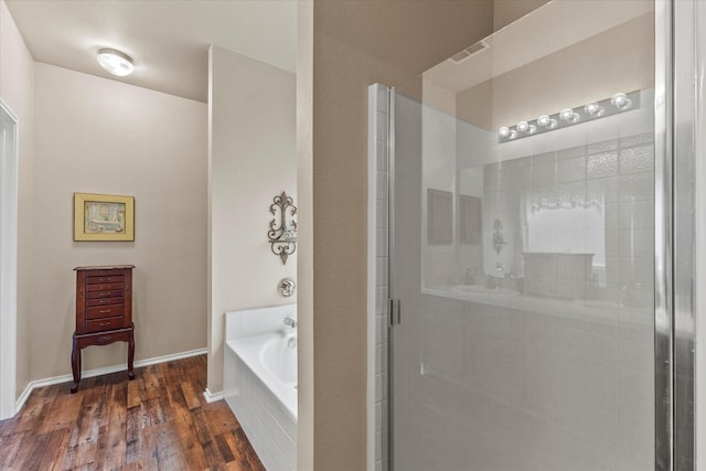 118 Independence Trl, Forney, TX 75126 - full bath featuring a stall shower, a garden tub, and wood finished floors