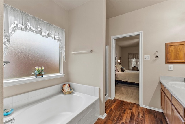 118 Independence Trl, Forney, TX 75126 - full bathroom featuring vanity, a garden tub, wood finished floors, and ensuite bathroom