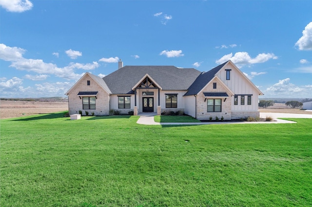 12965 Torello Ct, Godley, TX 76044 - modern farmhouse featuring board and batten siding, a front yard, french doors, and a chimney