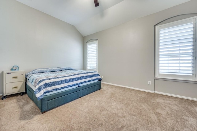 114 Stonecreek Dr, Irving, TX 75063 - bedroom featuring carpet floors, vaulted ceiling, and a ceiling fan
