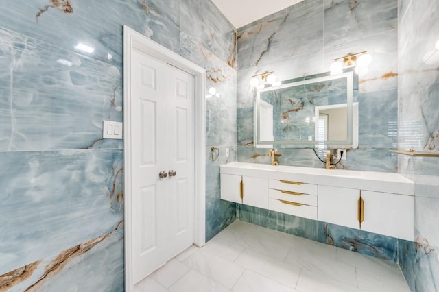 114 Stonecreek Dr, Irving, TX 75063 - full bath with double vanity, marble finish floors, and tile walls