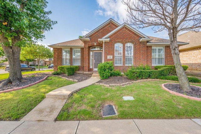 114 Stonecreek Dr, Irving, TX 75063 - view of front facade with brick siding and a front yard