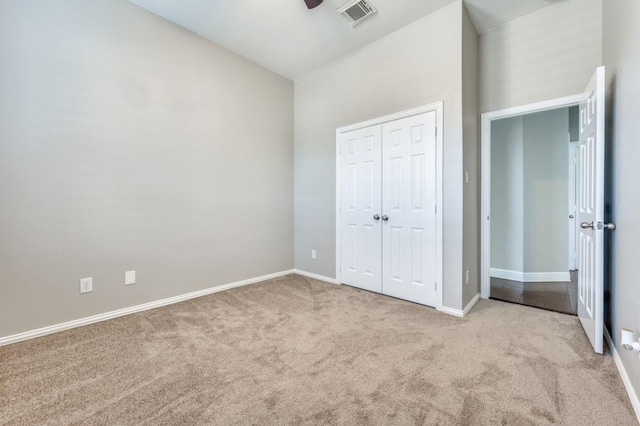 114 Stonecreek Dr, Irving, TX 75063 - unfurnished bedroom with carpet, a closet, and a ceiling fan