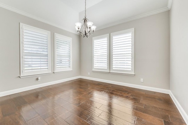114 Stonecreek Dr, Irving, TX 75063 - spare room featuring a chandelier, dark wood-type flooring, and ornamental molding