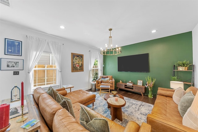 2340 Starks Ave, Dallas, TX 75215 - living room featuring a chandelier, recessed lighting, and wood finished floors