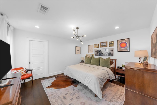 2340 Starks Ave, Dallas, TX 75215 - bedroom with dark wood-style floors, a chandelier, and recessed lighting