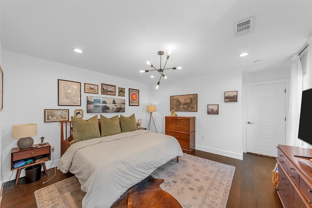 2340 Starks Ave, Dallas, TX 75215 - bedroom featuring dark wood finished floors, a chandelier, and recessed lighting