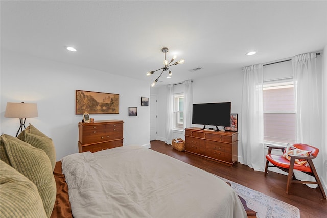 2340 Starks Ave, Dallas, TX 75215 - bedroom with a chandelier, dark wood-type flooring, and recessed lighting