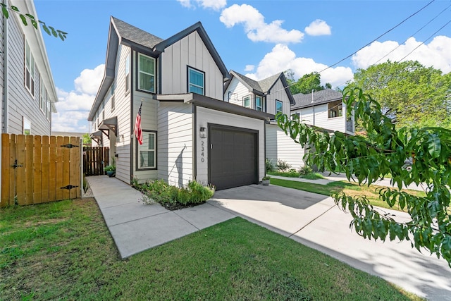 2340 Starks Ave, Dallas, TX 75215 - view of front of property featuring board and batten siding, concrete driveway, a garage, and a gate