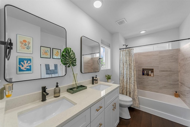 2340 Starks Ave, Dallas, TX 75215 - full bath with plenty of natural light, double vanity, shower / bathtub combination with curtain, wood finished floors, and recessed lighting