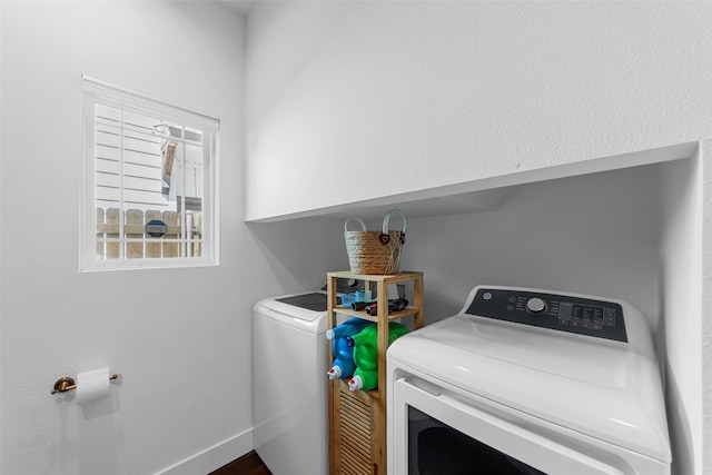 2340 Starks Ave, Dallas, TX 75215 - laundry room with independent washer and dryer and baseboards