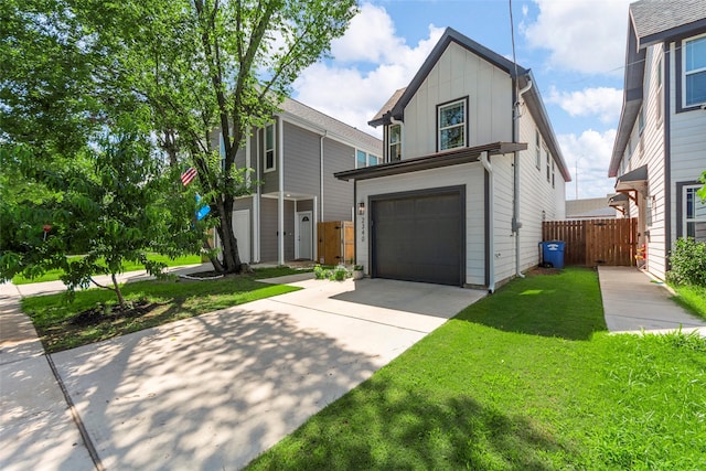 2340 Starks Ave, Dallas, TX 75215 - view of front facade with board and batten siding, an attached garage, concrete driveway, and a storage shed