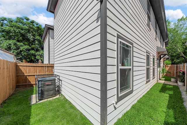 2340 Starks Ave, Dallas, TX 75215 - view of home's exterior featuring a fenced backyard and a central air condition unit