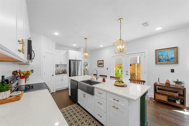 2340 Starks Ave, Dallas, TX 75215 - kitchen with freestanding refrigerator, range, dishwasher, tasteful backsplash, and light countertops